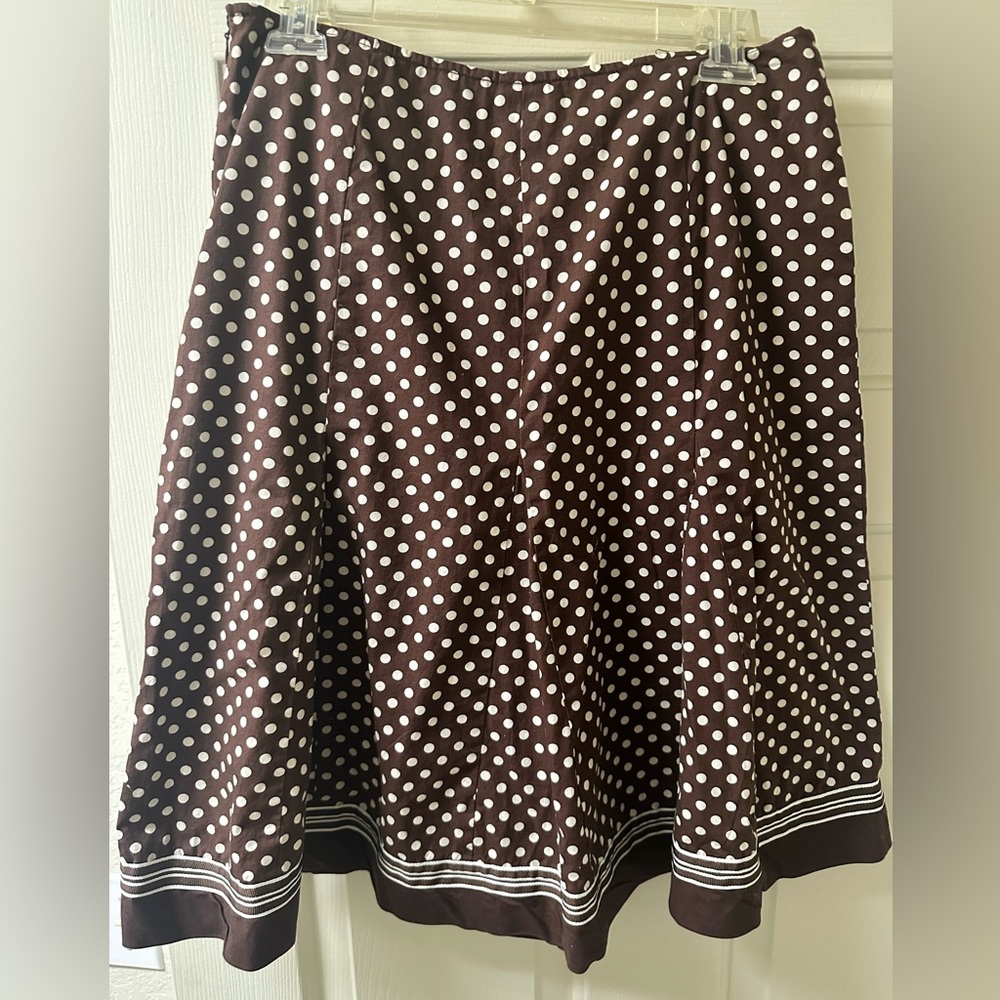 Brown and white polka dotted poodle skirt.
